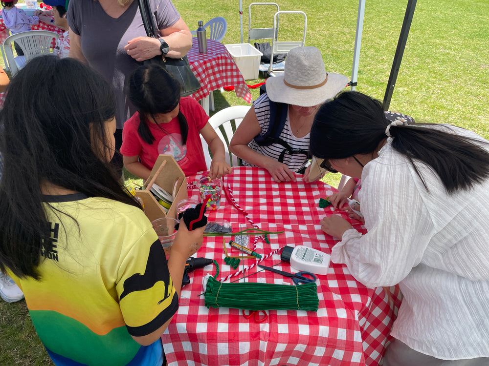 Children and adults crafting together at a local Auckland event