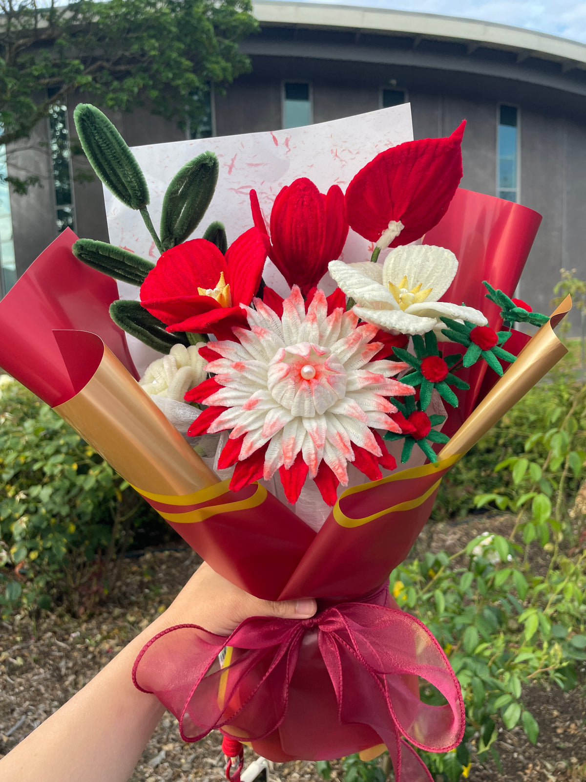 Red and white handcrafted Christmas flower bouquet