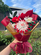 Red and white handcrafted Christmas flower bouquet